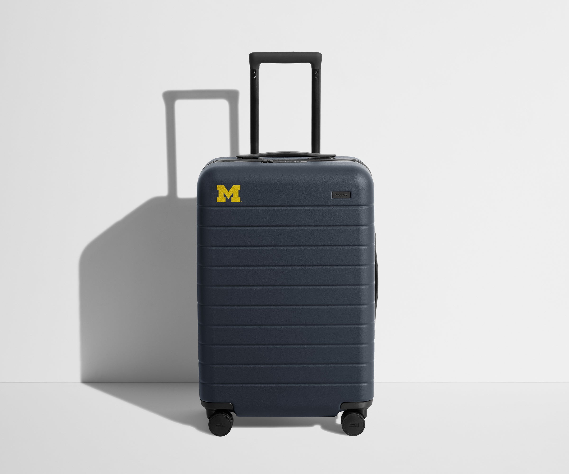 Away The Collegiate Bigger Carry-On Suitcase - University of Michigan ™