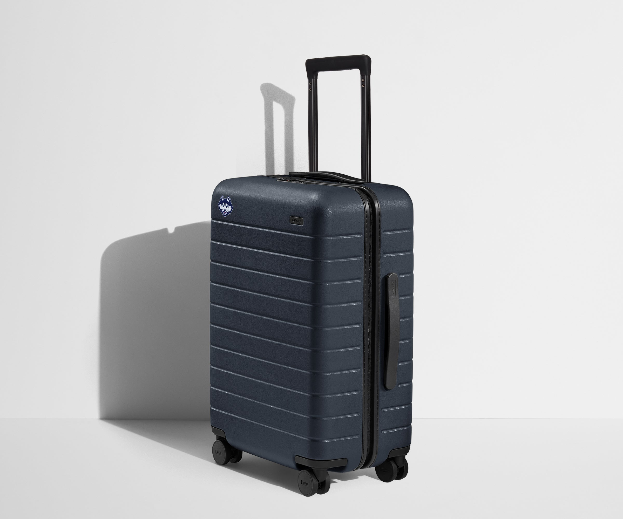 Away The Collegiate Bigger Carry-On Suitcase - UConn ®