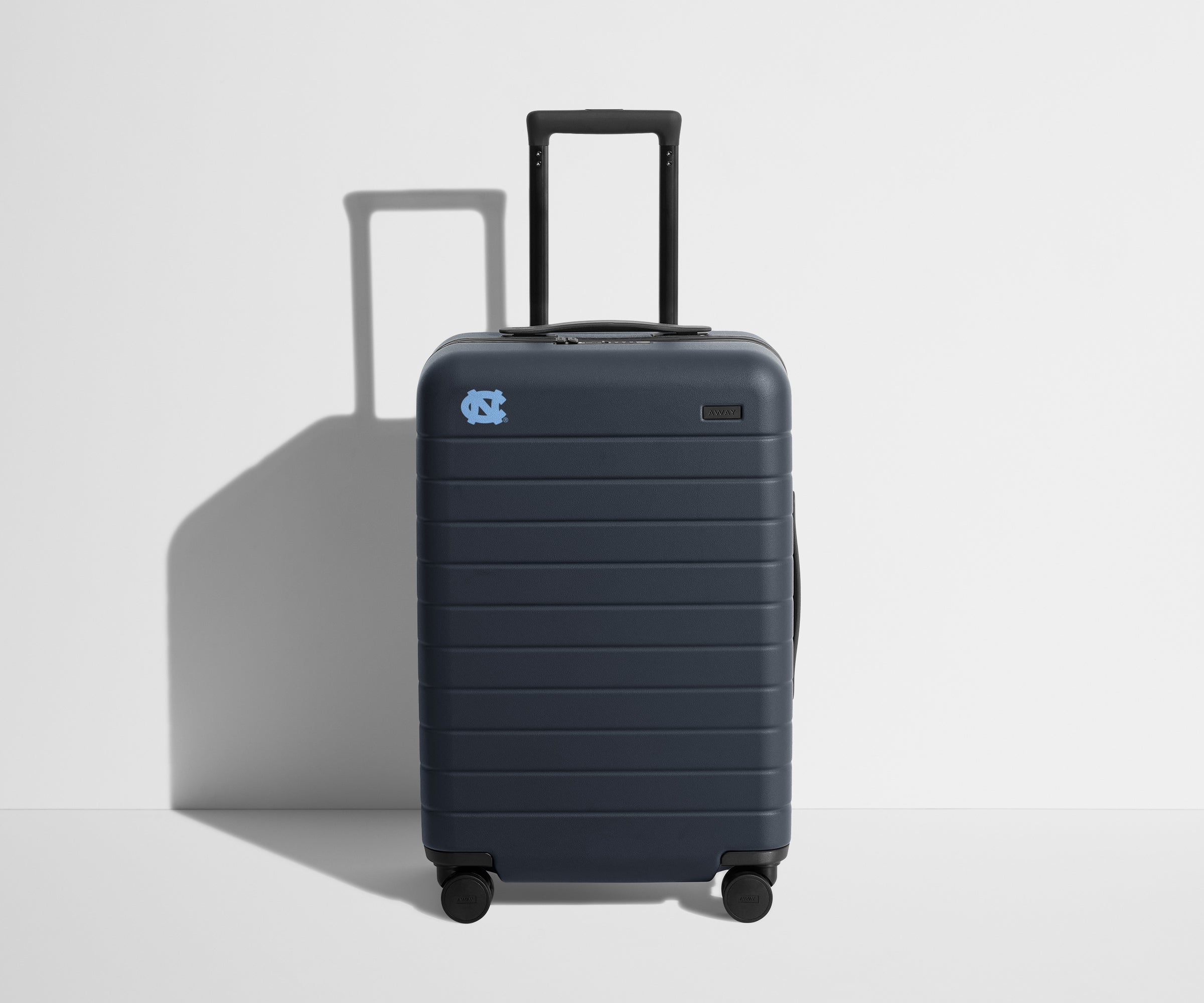 Away The Collegiate Bigger Carry-On Suitcase - University of North Carolina ®